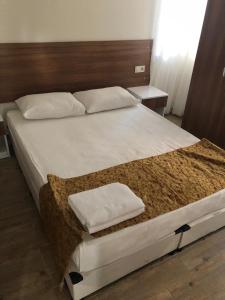 Postel nebo postele na pokoji v ubytování Valeri Beach Hotel