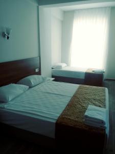 Postel nebo postele na pokoji v ubytování Valeri Beach Hotel