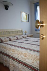 Postel nebo postele na pokoji v ubytování Hotel Ristorante La Rua + 9 fotografií