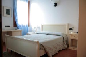 Postel nebo postele na pokoji v ubytování Hotel Ristorante La Rua
