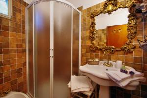 a bathroom with a shower and a sink and a mirror at Ca' Datu in Finale Ligure +46 photos