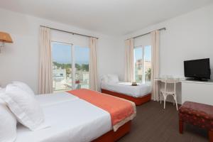 Posteľ alebo postele v izbe v ubytovaní Portofino Mallorca