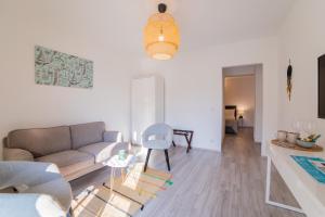 a living room with a couch and a table at Villa Astra in Brela