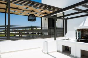 A balcony or terrace at Vilana White Elegant Villa