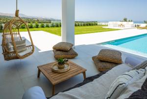 The swimming pool at or close to Vilana White Elegant Villa