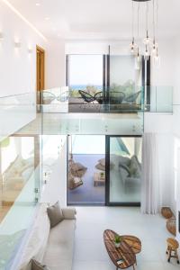 A bed or beds in a room at Vilana White Elegant Villa