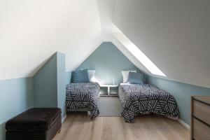 מיטה או מיטות בחדר ב-le ciel d'opale