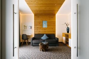 a living room with a couch and a table at Germanenhof in Sandebeck