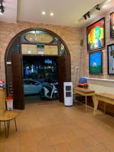 a store with a car parked in a garage at Gallery Homestay in Quy Nhon
