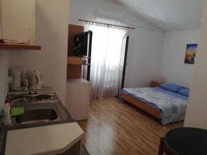 Apartman Dino客房内的一张或多张床位