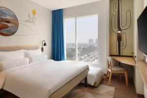 เตียงในห้องที่ ibis Styles Jakarta Simatupang