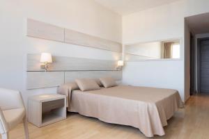 Säng eller sängar i ett rum på Hotel Palia Maria Eugenia
