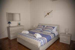 Ένα ή περισσότερα κρεβάτια σε δωμάτιο στο casa vacanze Agugliastra