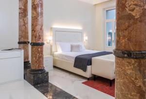 a bedroom with a white bed and a window at Villa Natalia Luxury Rooms in Verona