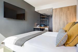 Cama o camas de una habitación en Acta Voraport