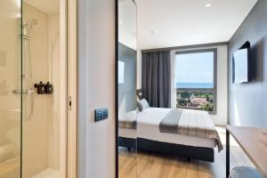 Cama o camas de una habitación en Acta Voraport