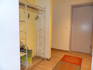 a room with a closet with a mirror and a door at Ferienwohnung Paula in Lichtenstein