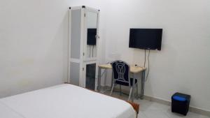 TV a/nebo společenská místnost v ubytování Nora Hotel