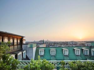 a view of the city from the roof of a building at Le Meurice – Dorchester Collection in Paris