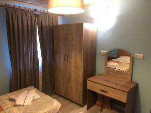 A bed or beds in a room at Assos Kadirga Hotel