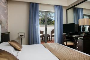 Postel nebo postele na pokoji v ubytování Hotel St.Mauritius