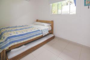 מיטה או מיטות בחדר ב-Cabaña Coveñitas 2
