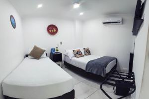 Cama ou camas em um quarto em Hotel Las Lunas