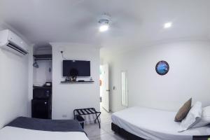 Cama ou camas em um quarto em Hotel Las Lunas