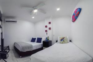 Cama ou camas em um quarto em Hotel Las Lunas