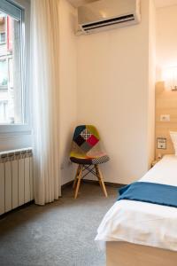 Cama ou camas em um quarto em MBM Studio Piata Romana Square