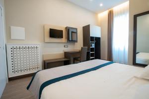 A bed or beds in a room at San Lorenzo - Boutique Hotel & SPA