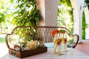 a table with a tray of drinks on a table at California Park Hotel in Forte dei Marmi