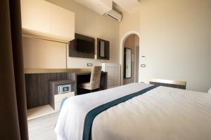 A bed or beds in a room at San Lorenzo - Boutique Hotel & SPA