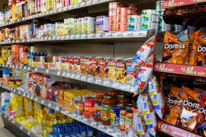a grocery store aisle with shelves filled with food at Winds Motel in Montague +11 photos