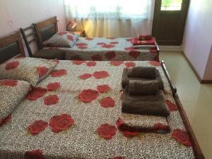 Ein Bett oder Betten in einem Zimmer der Unterkunft Alex's Cosy Guesthouse