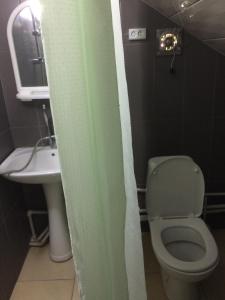 Ein Badezimmer in der Unterkunft Alex's Cosy Guesthouse