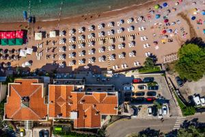 an aerial view of a resort with a beach at Hotel California by Aycon in Sveti Stefan