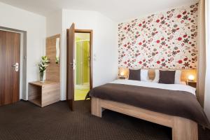 Postel nebo postele na pokoji v ubytování Hotel Bon