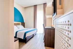 A bed or beds in a room at San Lorenzo - Boutique Hotel & SPA