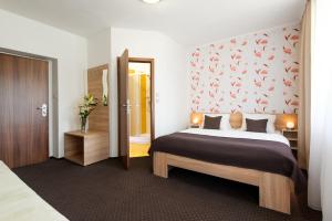Postel nebo postele na pokoji v ubytování Hotel Bon
