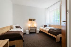 Postel nebo postele na pokoji v ubytování Hotel Bon