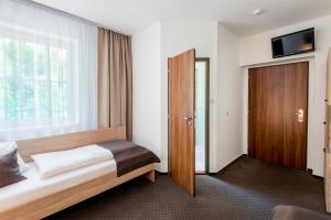 Postel nebo postele na pokoji v ubytování Hotel Bon
