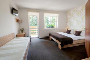 Postel nebo postele na pokoji v ubytování Hotel Bon