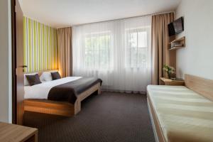Postel nebo postele na pokoji v ubytování Hotel Bon