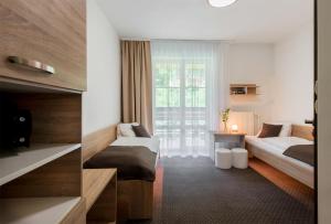 Postel nebo postele na pokoji v ubytování Hotel Bon