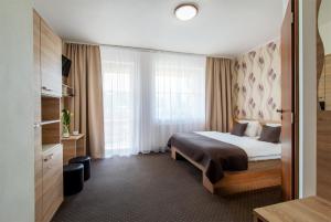 Postel nebo postele na pokoji v ubytování Hotel Bon