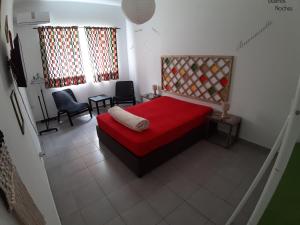 Cama ou camas em um quarto em Alameda Hostel