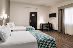 Voodi või voodid majutusasutuse Wyndham Costa del Sol Piura toas