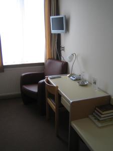 TV a/nebo společenská místnost v ubytování Hotel Ekamper