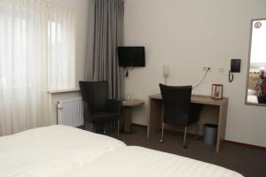 TV a/nebo společenská místnost v ubytování Hotel Ekamper